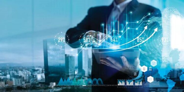 Digital marketing. Business strategy. Businessman using tablet analyzing sales data and economic growth graph chart on hologram screen. Business strategy and digital data.