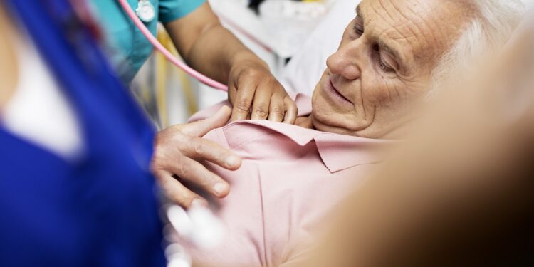NPSNewProduction, UK, England, hospitals, medical, medical occupations, medical care, examinations, nurses, stethoscopes, auscultating, auscultate, listening, heart, heartbeat