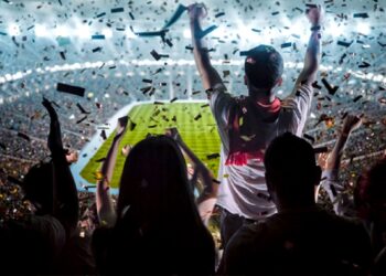Group of fans are cheering for their team victory