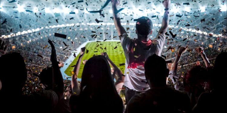 Group of fans are cheering for their team victory