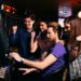 Young people at slot machine in the casino