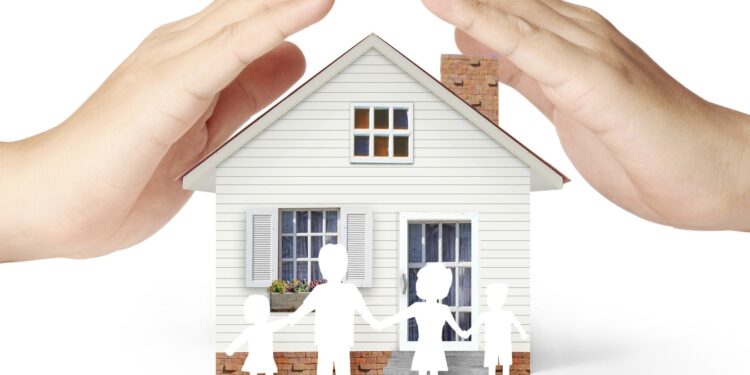 holding house representing home ownership