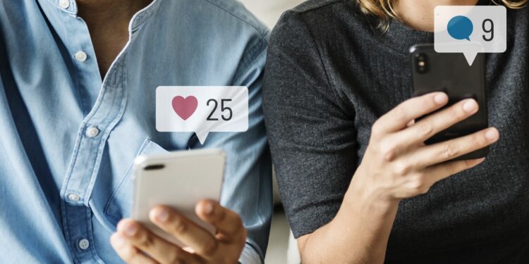 Happy people using social media on their smartphones