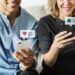 Happy people using social media on their smartphones