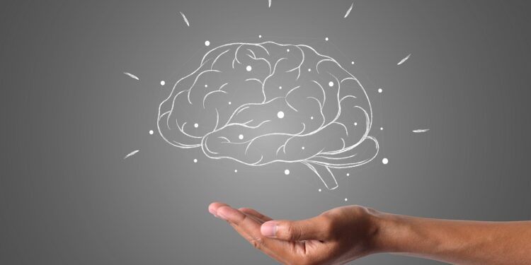 brain writes with white chalk is on hand, draw concept.