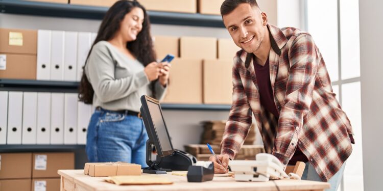 Man and woman ecommerce bussines workers working at office
