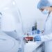 Woman collecting blood samples for testing on different diseases, modern laboratory, copy space