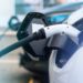 Plugged in chargers into two electric cars at charge station