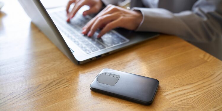 A woman using the internet with a mobile router