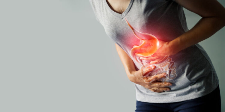 Woman touching stomach painful suffering from stomachache causes of menstruation period, gastric ulcer, appendicitis or gastrointestinal system disease. Healthcare and health insurance concept.