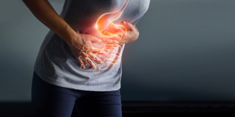 Woman touching stomach painful suffering from stomachache causes of menstruation period, gastric ulcer, appendicitis or gastrointestinal system disease. Healthcare and health insurance concept.