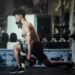 Strong bodybuilder with perfect deltoid muscles, Close-up of a Handsome power fitness man in training pumping up muscles with dumbbell.