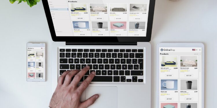 office tabletop with tablet, smartphone and laptop showing online shop responsive design website