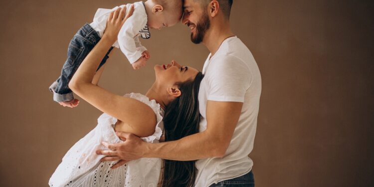 Happy family with their first child