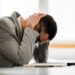 Young businessman is tired of overwork. He is depressed.