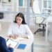 High angle portrait of young woman answering questions during job interview in office, copy space