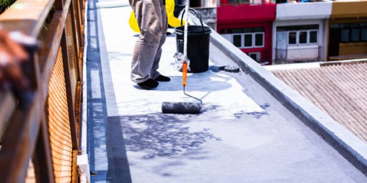 Painted gray flooring on fiber glass with paint rollers for waterproof, reinforcing net, Repairing waterproofing deck flooring.