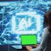 IT specialist using green screen laptop and AI technology for business data analysis in high tech setting. Engineer works on mockup notebook to automatize tasks using artificial intelligence, camera B