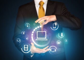 Businessman holding digital media icons
