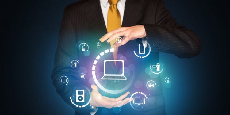 Businessman holding digital media icons