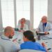 Healthcare workers having meeting in hospital conference room about symptoms of patients analysing x-ray. Clinic expert therapist talking with colleagues about disease, medicine professional