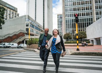 Coworkers talking and walking through the city