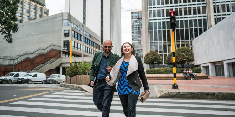 Coworkers talking and walking through the city
