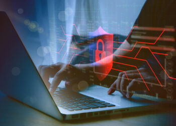 human hand using computer to surf the internet  There are security systems to protect against hackers, business ideas, internet, network security.