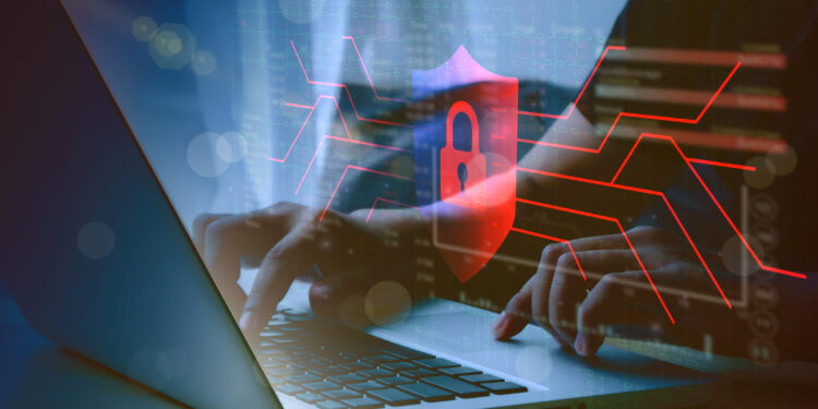 human hand using computer to surf the internet  There are security systems to protect against hackers, business ideas, internet, network security.