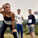 Happy sportswoman feeling exhausted after running a marathon in nature.
