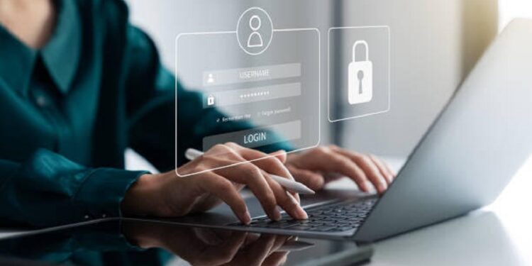 Securing cybersecurity, A Businesswoman protecting personal data on laptops and virtual interfaces, Preventing Online Theft, Cybersecurity concepts.
