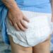 Asian senior or elderly old lady woman patient wearing incontinence diaper in nursing hospital ward, healthy strong medical concept.