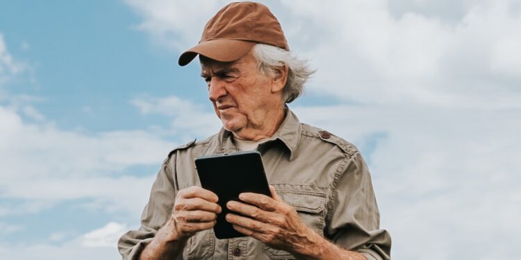 Farmer inspecting soybean plantation