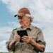 Farmer inspecting soybean plantation