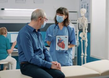 Female assistant holding tablet with cardiovascular system illustration, explaining heart condition to retired person during covid 19 pandemic. Nurse showing cardiology diagnosis on gadget. SSUCv3H4sIAAAAAAAAA02Sy27cMAxF/0XrIWq9pfmCboJ2H3RBSVTGjcce2HKDYOB/Lz2PtF4YInl0dUHyKvoijiJlq0wxDijkCEaFDAFNgoRKJjImWIXiIAo2EkepVfRKBxN8dN3+HUTCpc/ieBX9MKxLm7H10yiOXJlpLDTfjlT6Ns09DhxtB7E0bOtCC1/jKLP2G1dv8VPv9brn2eB3wqGdMs707YVlMmuwwJq49CP9ptwWsR2e8E+aLgN9AS/9kmkYcKRp/R/7AsT26yDwjcb8uXvZdtMD4c3aq7DVJCdNgWyrBWNTAAz8IyyddjnGbA1LoXGqEGO+OgUmGwnopYJaY+drcCUXxZja+WQ1dCVUVssGojMZpHNOx2hLNIkx6iwpqxK4wmMwBiOkIA1474KXFZ1ylbHQuai8yqBsJjAuJcBCHeSUpCzKVoqOMRaxXsYAKqMG06kOQvQFULPDkhTKsquhttlaX6HzkbeAb0FE9tZVMpKNa1s8Y7JmTE4T51PHy6I074kx4FRKpJPOKkrBHX3/aDSfH+Od2mnfAu79tI5t/rz3f5imCyae1bHisNBBnHBZGCiPBF+8zH3ux7fHkvBuTef7eZzaPqDbGNuU3/vyeOq+V6ees/s7V7FehonbUh7lNZ371p7hTH96+vhHb9v2F7TWcWsVAwAA