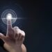 Biometric technology background with fingerprint scanning system on virtual screen digital remix