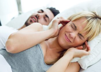Portrait of woman who can not sleep because her husband snores.