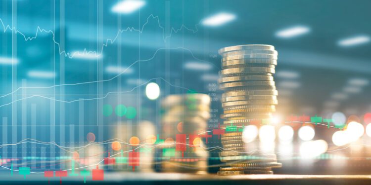 Finance and business investment concept. Graph and rows with statistic growth of coins on table.