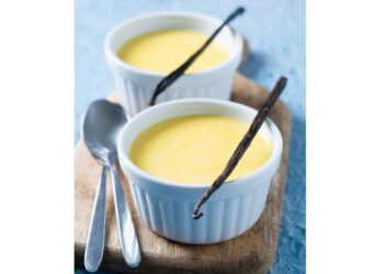 homemade vanilla custard on blue background