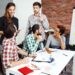 colleagues discussing new ideas at business meeting.