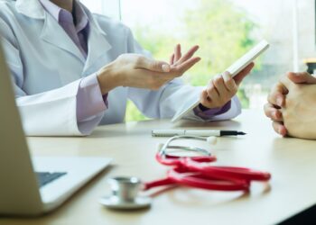 doctor and patient are discussing something.