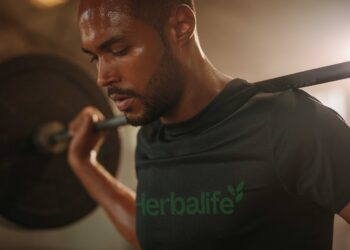 closeup of man lifting barbells