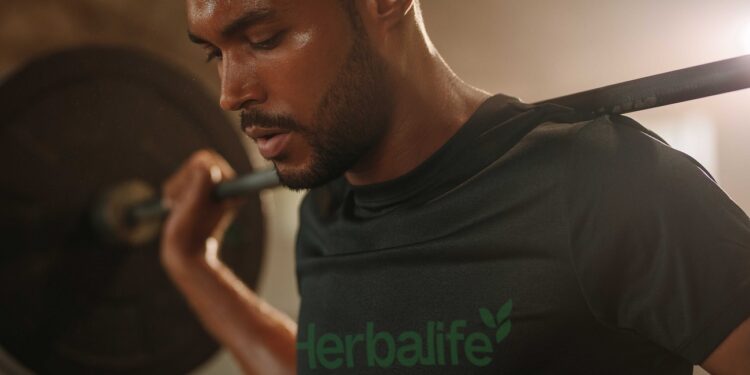 closeup of man lifting barbells