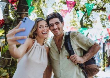hispanic,young,couple,taking,photo,selfie,on,vacations,or,holidays