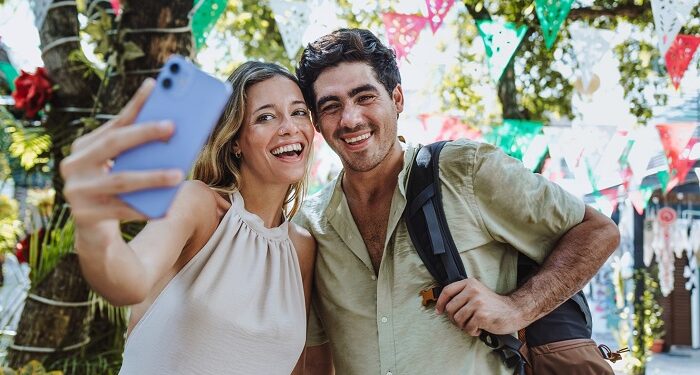 hispanic,young,couple,taking,photo,selfie,on,vacations,or,holidays