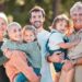 this is all of us. shot of a multi generational family posing together outdoors