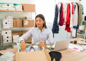 happy entrepreneur is shipping packages