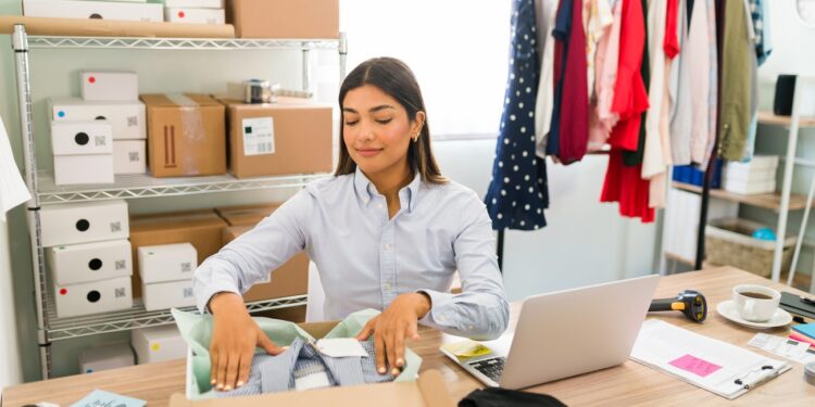 happy entrepreneur is shipping packages