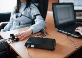 fidelity verification. girl passes lie detector in the office. asking questions. polygraph test
