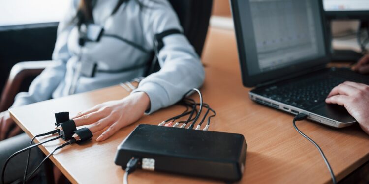 fidelity verification. girl passes lie detector in the office. asking questions. polygraph test